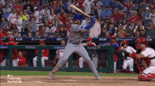 a baseball player is getting ready to swing at a pitch