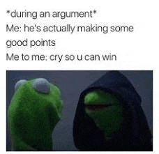 kermit the frog is wearing a black hood and talking to a man in a hood .