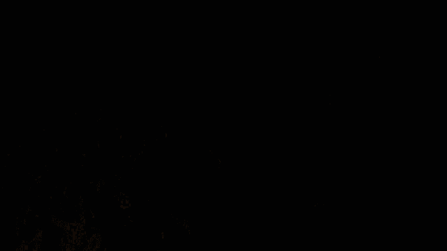 a man in a red shirt with the letter n on it is cheering in a crowd