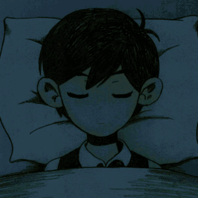 a boy is sleeping with his eyes closed in a bed