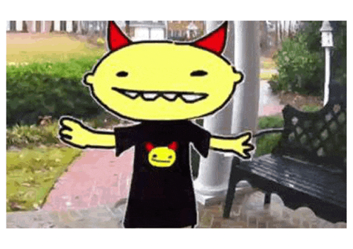 a cartoon character is wearing a black shirt with a devil face on it and red horns .