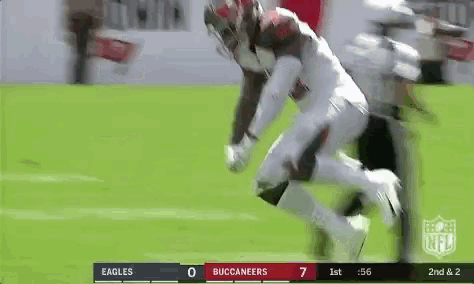 a football game is being played between the buccaneers and the eagles