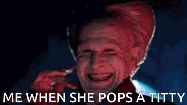 a man with a red head is laughing with the words me when she pops a titty below him