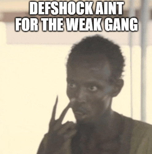a man with his finger in his nose and the words defshock aint for the weak gang above him