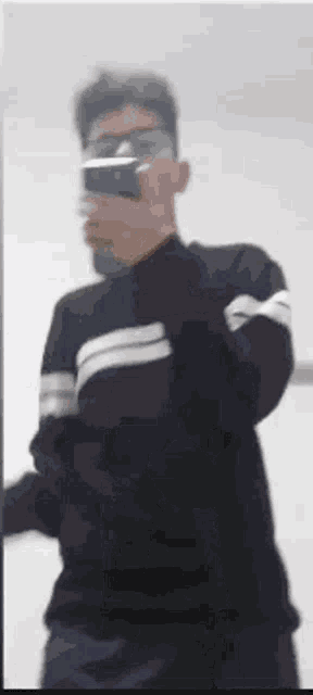 a man is taking a picture of himself in the mirror .