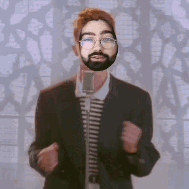 a man with a beard is singing into a microphone