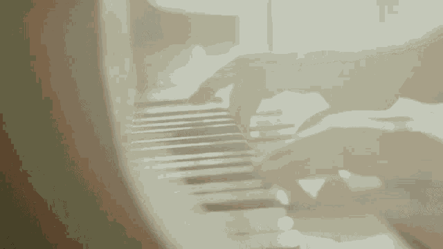 a close up of a person playing a piano keyboard