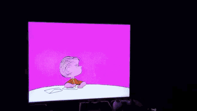a cartoon of lucy sitting in front of a lamp on a screen