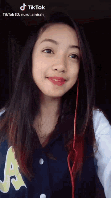 a girl wearing headphones and a shirt that says a on it