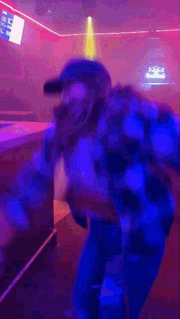 a blurry photo of a person dancing in a club