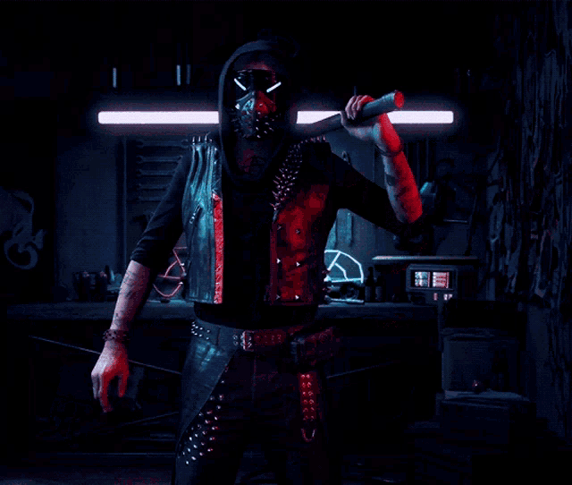 a man wearing a mask and a hood is holding a stick