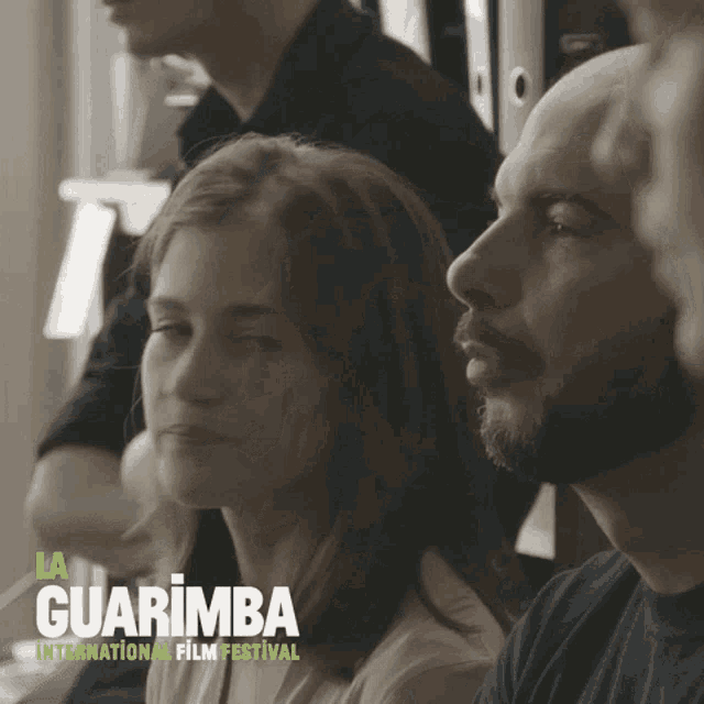 a poster for the guarimba international film festival shows a group of people