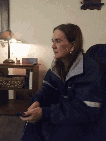 a woman wearing a jacket that says columbia on the front