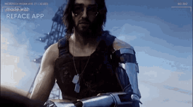 a man with a beard and sunglasses is wearing a robotic arm