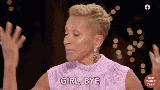 a woman in a pink sweater says " girl bye " with her hands in the air