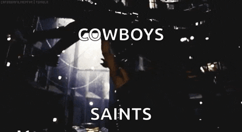 a man standing in a dark room with the words cowboys saints written on the bottom