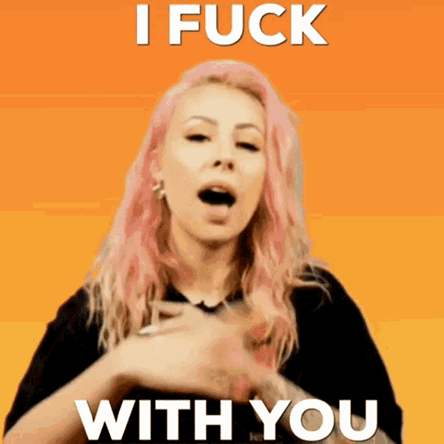 a woman with pink hair is making a funny face and says i fuck with you