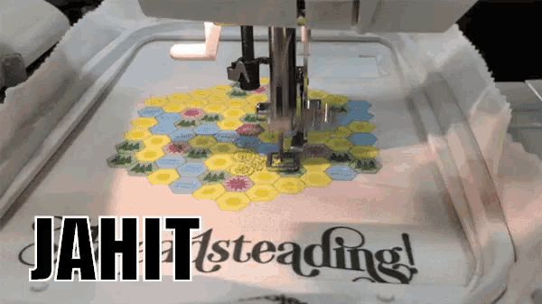 a sewing machine with the words " jahit 1st reading " on the top