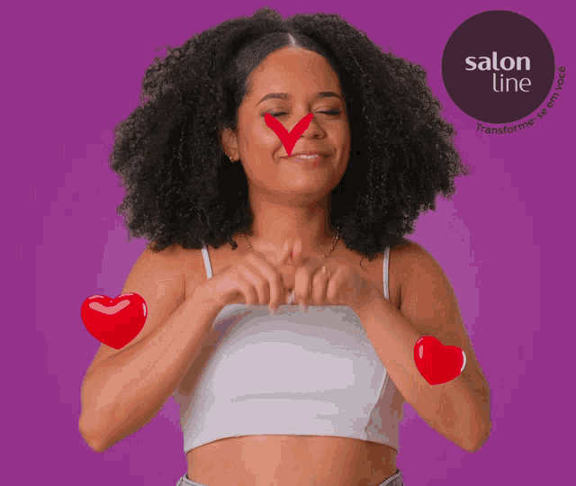 a woman is making a heart shape with her hands with a salon line logo behind her