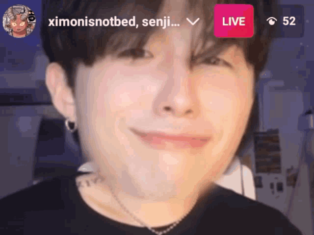 a close up of a person 's face with a live icon in the corner