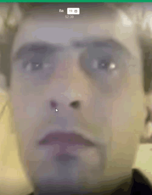 a close up of a man 's face with a time of 5:29
