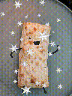 a piece of bread with arms and legs is on a plate with stars around it