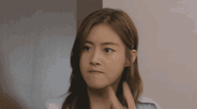 a close up of a woman 's face with mbc written on the bottom
