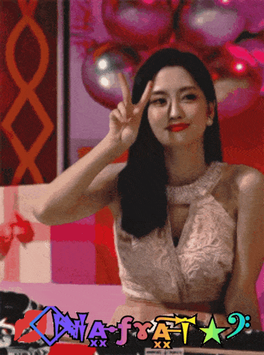 a woman in a white dress giving a peace sign in front of a sign that says dna-f-a-t