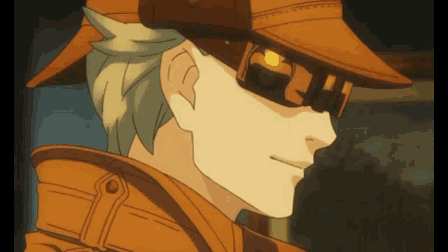 a close up of a man wearing a hat and goggles