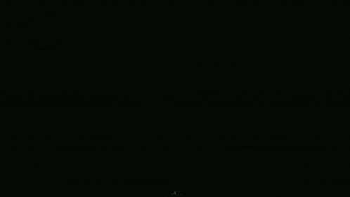two blue circles with a yellow center on a dark background