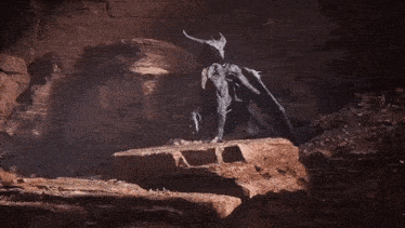 a statue of a dragon standing on a rock