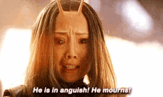 a woman with horns on her head is crying and says he is in anguish he mourns
