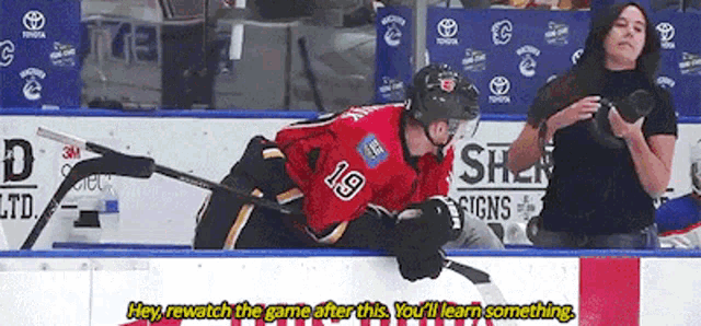a hockey player with the number 19 on their jersey