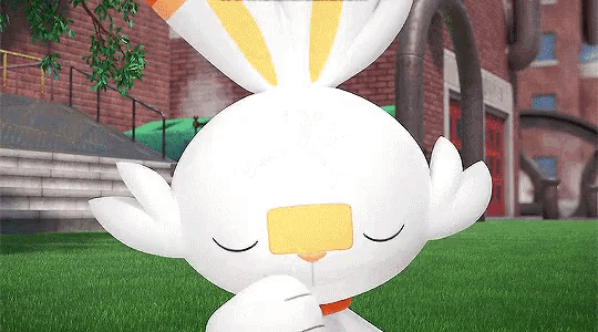 a white rabbit with yellow stripes on its ears is sitting on the grass