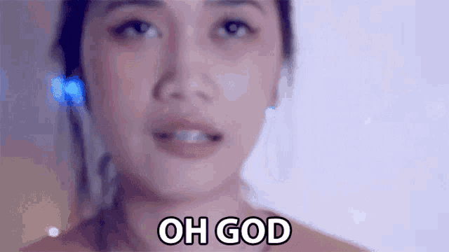 a woman is making a face and saying `` oh god '' .