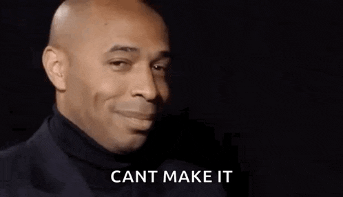 a bald man in a black suit is smiling and saying cant make it .