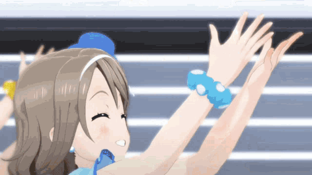 a girl with a blue hat and a blue bracelet on her wrist is giving a high five