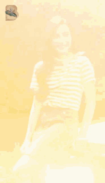 a pixelated image of a woman wearing a striped shirt