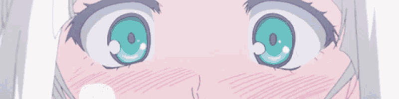 a close up of a girl 's eyes with a heart in them