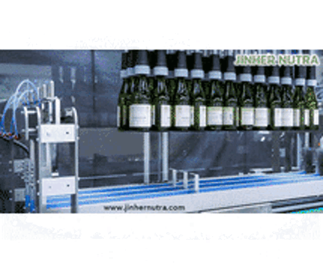 a conveyor belt with bottles on it and the words jinher nutra