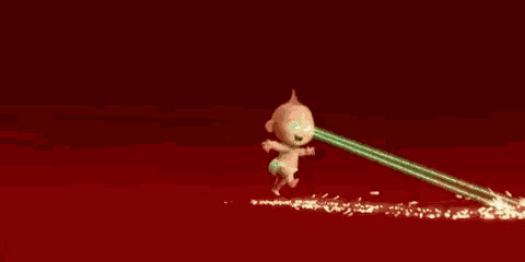 a person is standing in front of a green light that is shining on them .