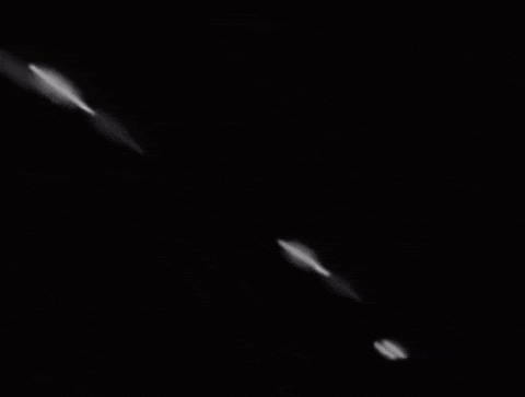a black and white photo of a rocket being launched into the air