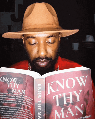 a man in a hat is reading a book titled know thy man