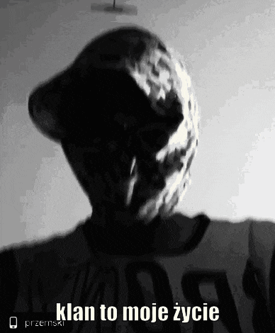 a black and white photo of a person with a mask on their face and the words `` klan to moje zycie '' .