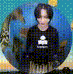 a person standing in front of a globe with the word youth written on it