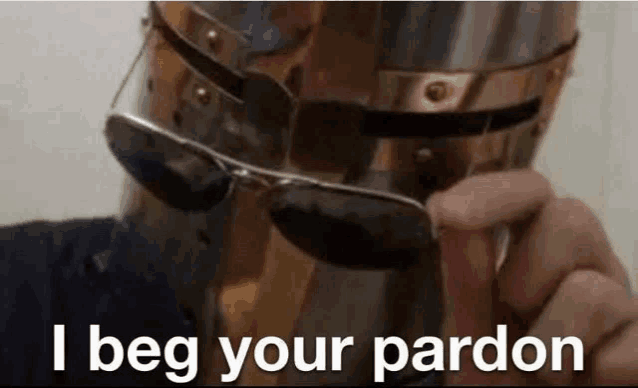 a person wearing a helmet and sunglasses with the words `` i beg your pardon '' written below them .