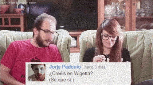 a man and a woman sit on a couch with a picture of jorje padonio