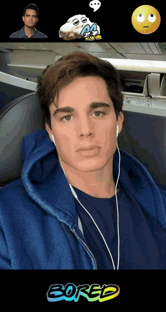 a young man wearing headphones and a blue hoodie with the word bored on the bottom
