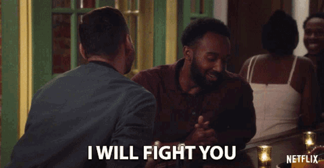 a netflix ad shows two men sitting at a table and one of them says " i will fight you "
