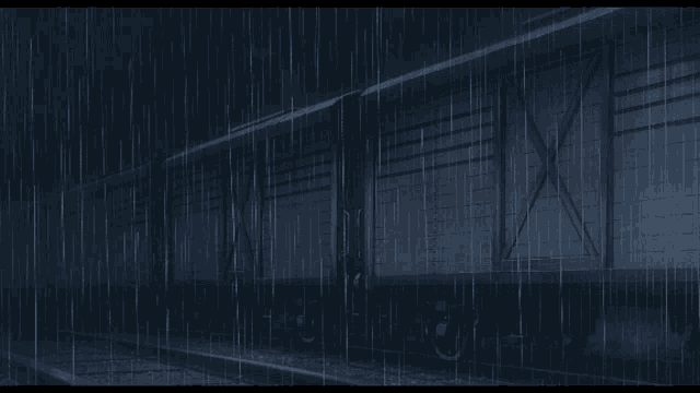 a train car is sitting in the rain with the doors open